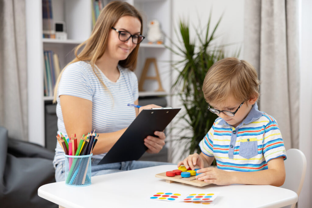 Child Engaged in Educational Activity with Teacher in Classroom Setting